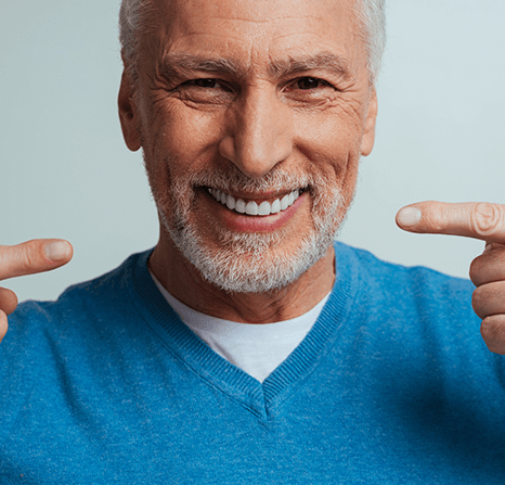 A patient proud with his dentures.